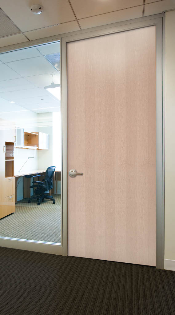 Commercial wood door installed in an office